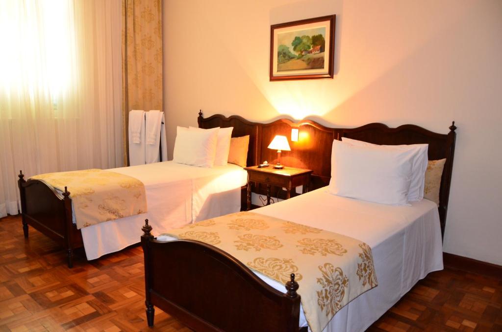 Postel nebo postele na pokoji v ubytování Hotel Glória Resort & Convention