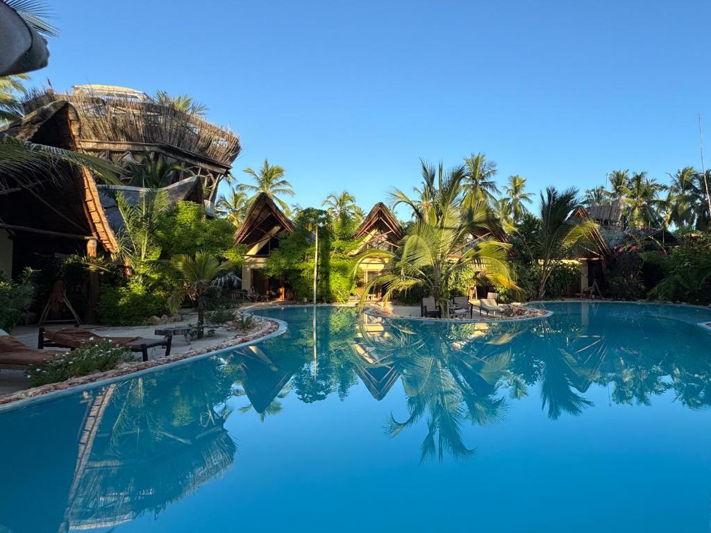 a view of a pool at a resort at MONEA The Nest in Paje