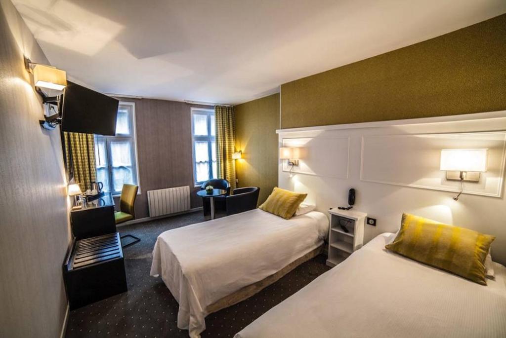 Postel nebo postele na pokoji v ubytování Logis Hôtel & Restaurant - Les Hauts de Montreuil