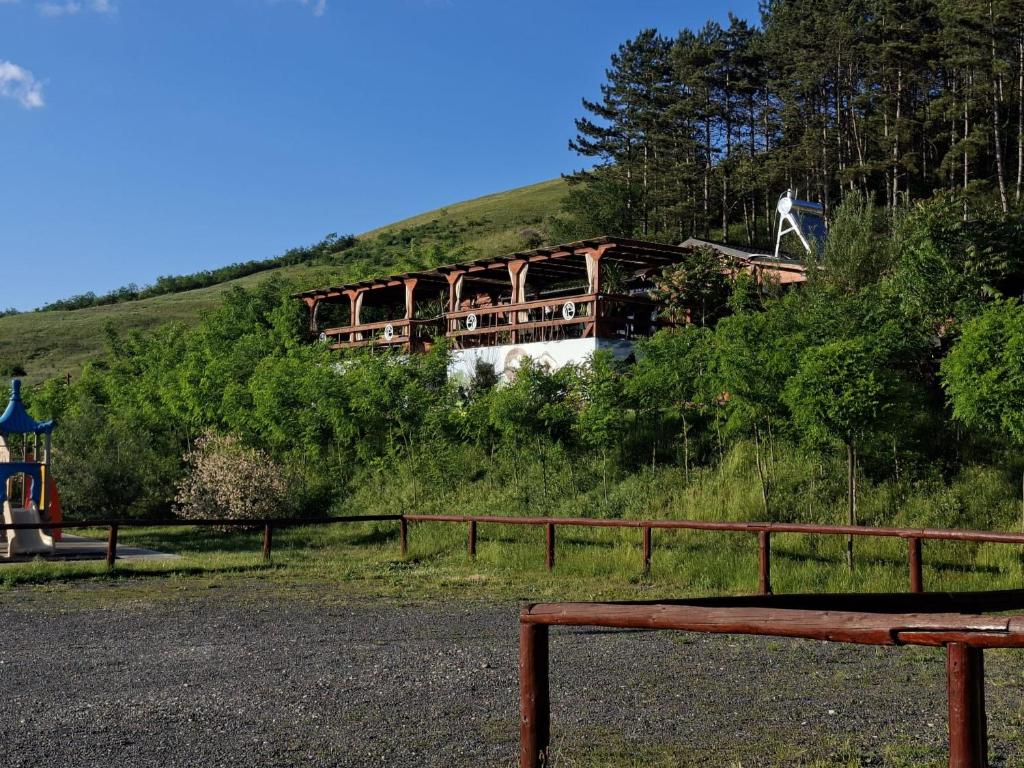 a building on the side of a hill at La Hacienda in Cheţani
