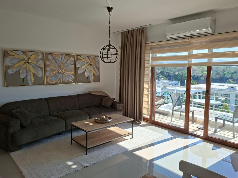 a living room with a couch and a table at Sun Valley 2-bedroom apartment in Nicosia International Airport