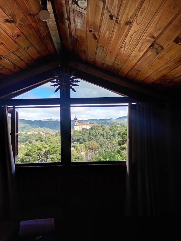 a window in a room with a view at Dexa Hospedagem in Ouro Preto