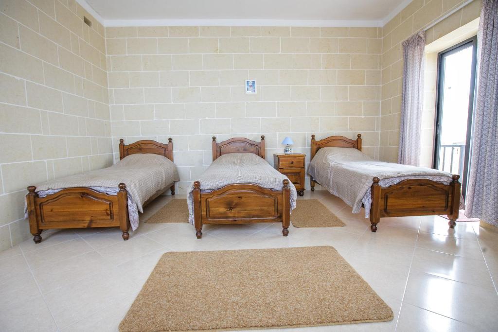 Tempat tidur dalam kamar di Hili Complex