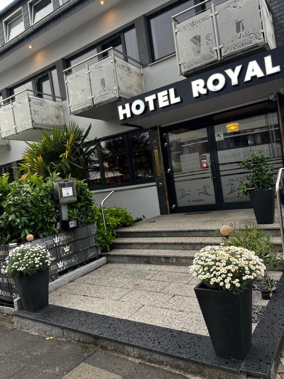 a hotel lobby with stairs in front of a building at Hotel Royal in Bad Salzuflen