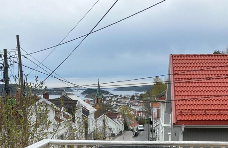 a view of a city with a red roof at Ferieleilighet Kragerø in Kragerø
