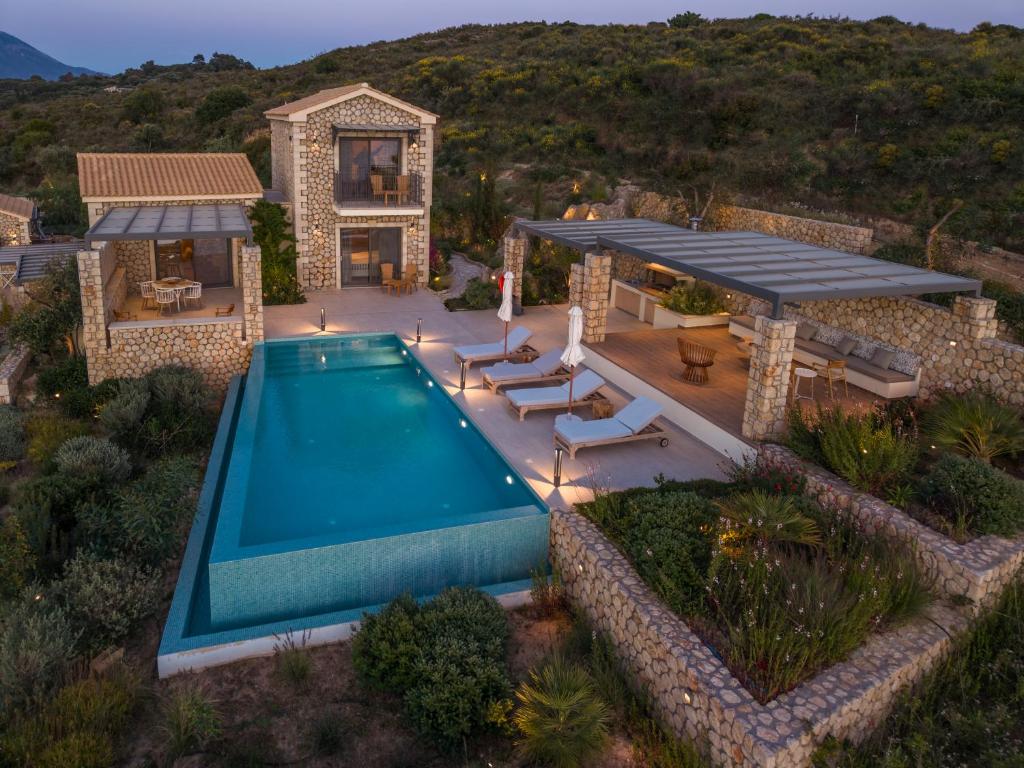 an aerial view of a house with a swimming pool at Zeus Luxury Villas - Villa Poseidon in Kefallonia