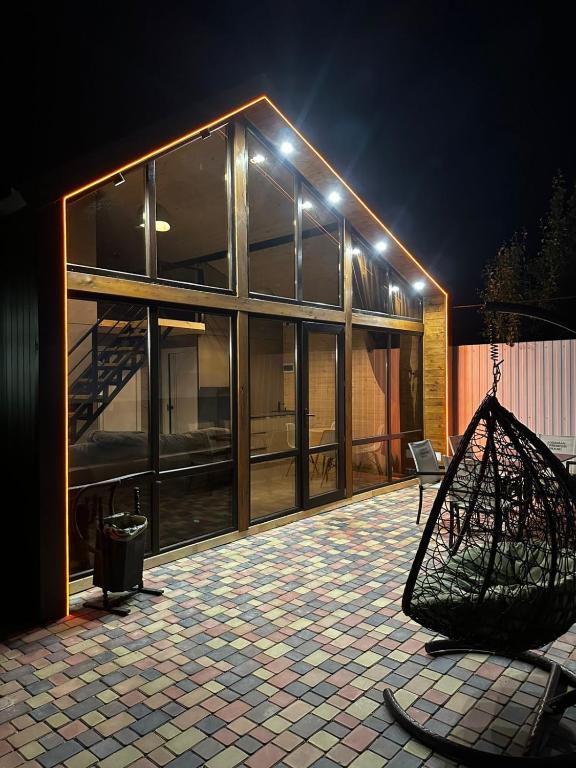 a building with a net in front of it at night at Green Village in Balqash