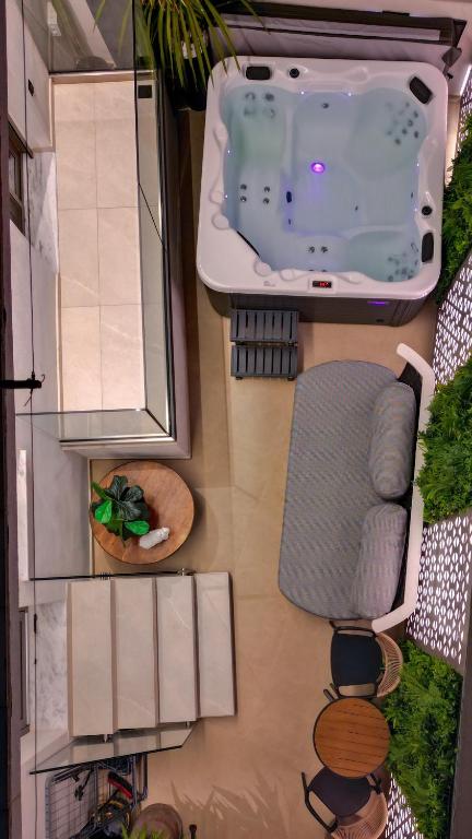 an overhead view of a bathroom with a tub at Sentio Thassos Suites in Limenas