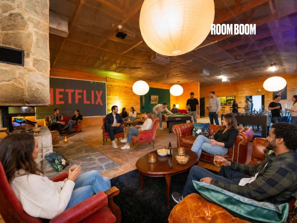 a group of people sitting in chairs in a lobby at Bendorfer Stadl mit Whirlpool & Sauna in Bendorf