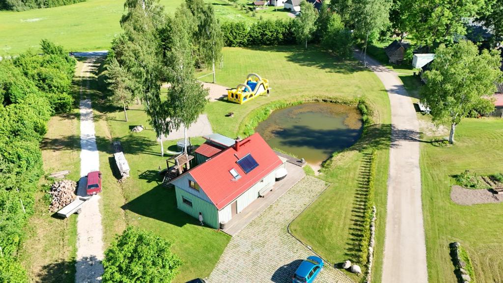 an aerial view of a house with a playground at Möllatsi Saunamaja in Möllatsi