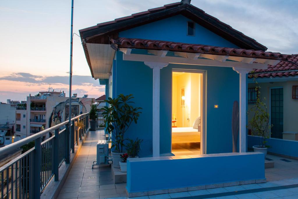 a blue house on top of a balcony at Blue Loft 360 in Patra