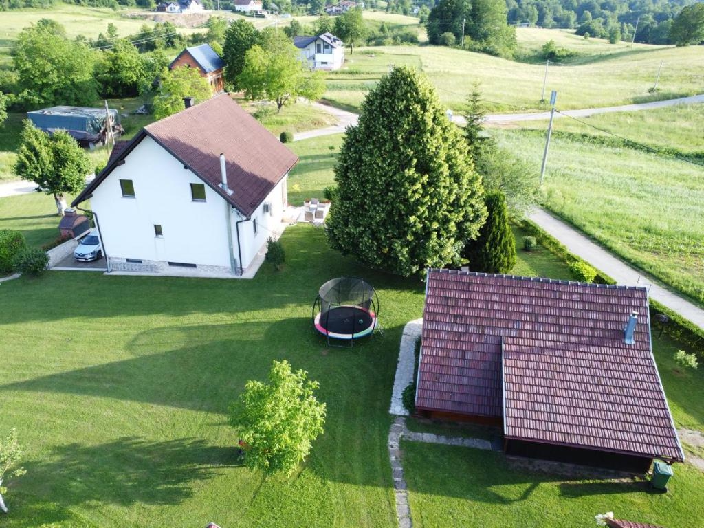 an aerial view of a white house with a roof at Apartment Golden Fields in Smoljanac