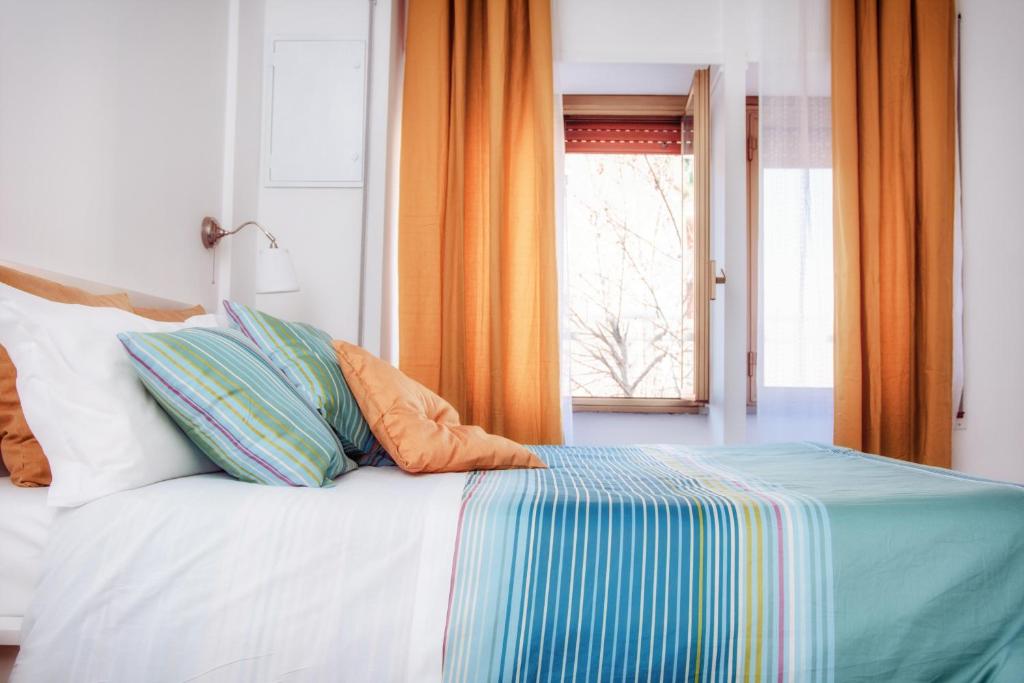 A bed or beds in a room at De Guestibus