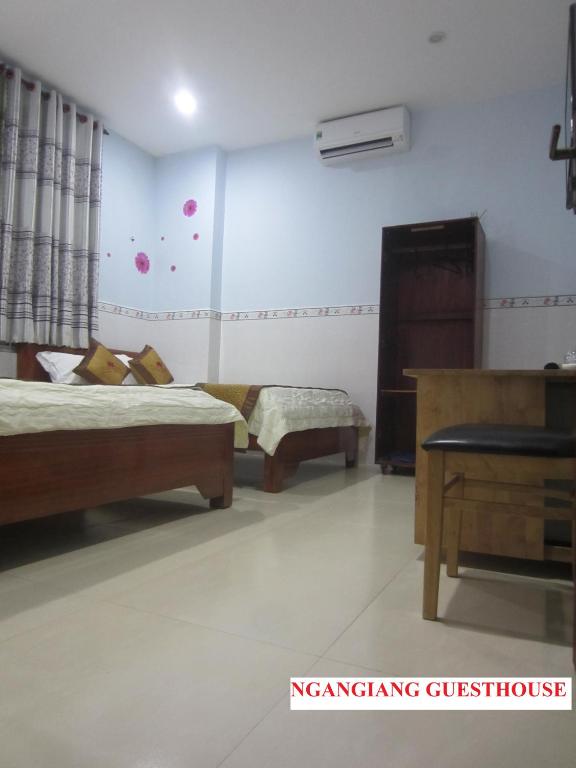 Postel nebo postele na pokoji v ubytování Ngan Giang Guesthouse