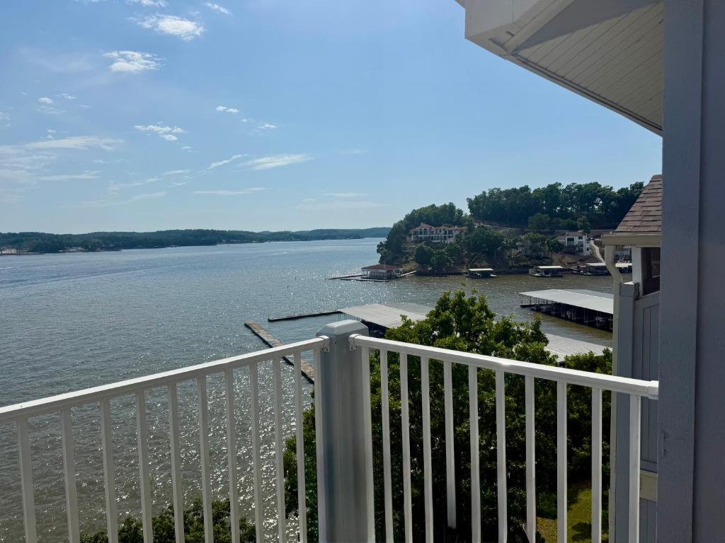 a view of the water from the balcony of a house at Spacious Lakeview Condo with 3 BR3 BA and Pool in Lake Ozark