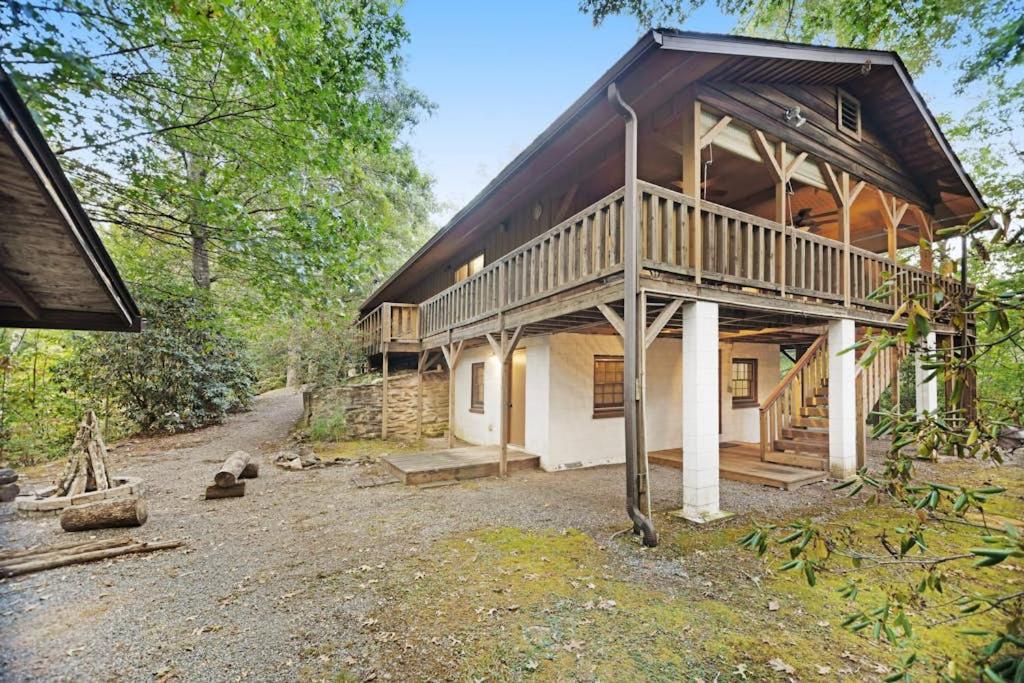 a large wooden house in the middle of a forest at Hollow's End in Whittier