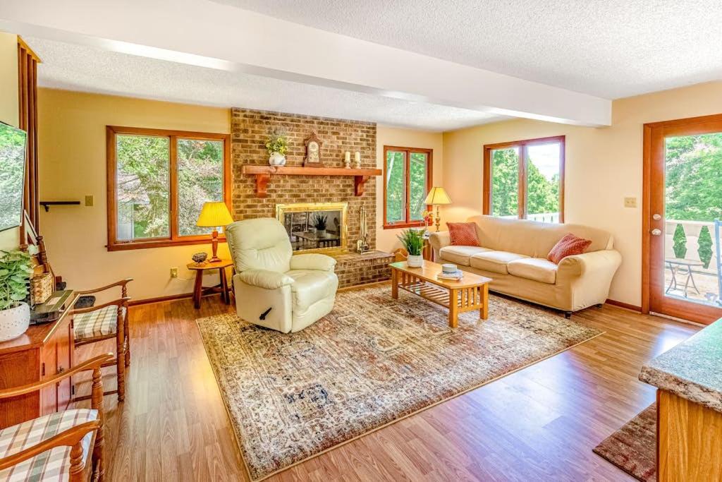 a living room with a couch and a fireplace at Grin and Bear It in Whittier