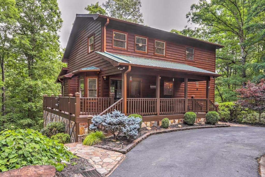 a wooden house with a driveway in front of it at Oasis In the Mountains in Murphy