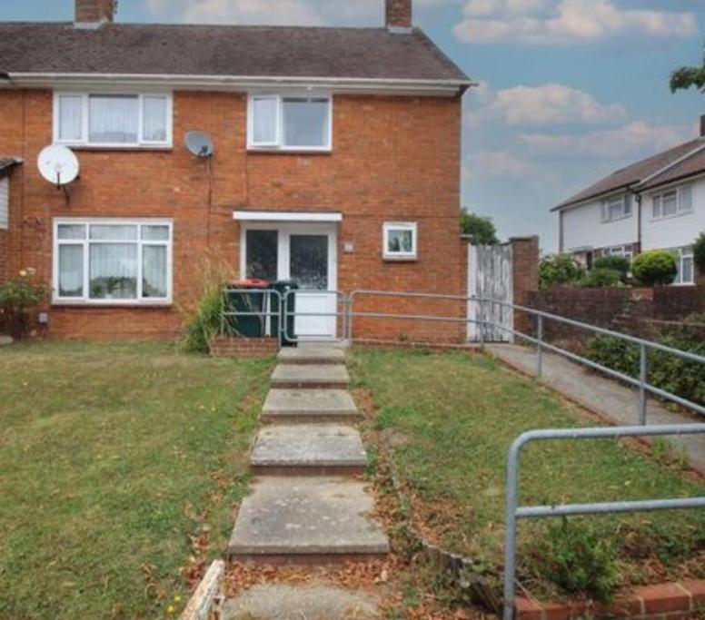 a brick house with a staircase in front of it at 6 bedroom house Trochetia in Crawley