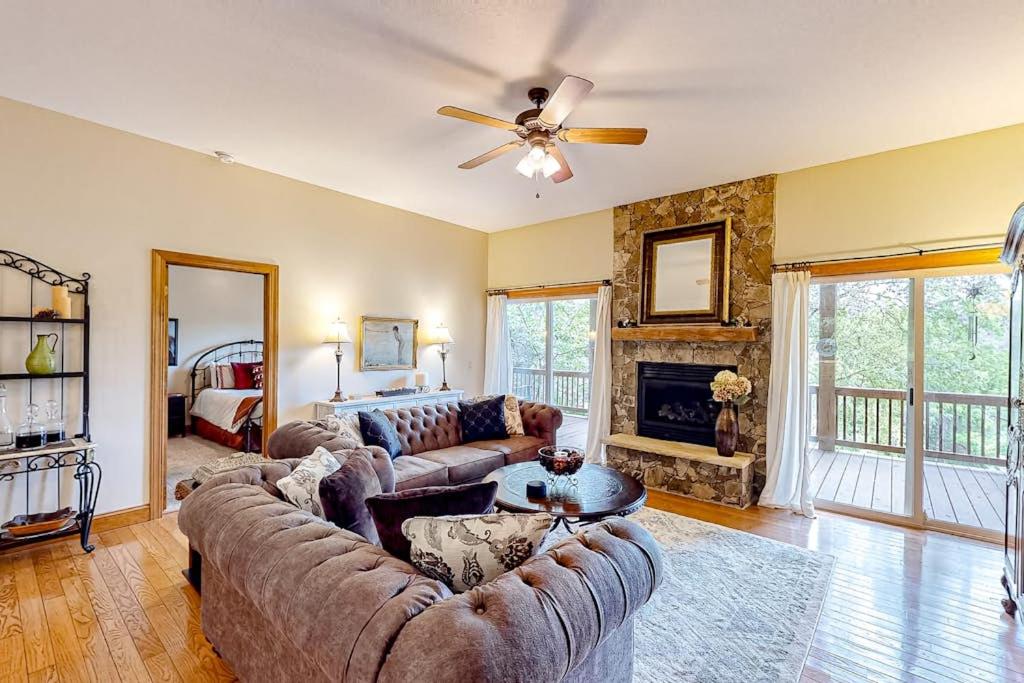 a living room with a couch and a fireplace at Link Vacation in Whittier