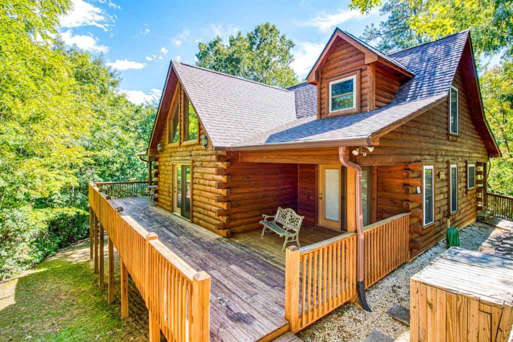 a log cabin with a large wooden deck at Wunderland Cabin in Lake Lure