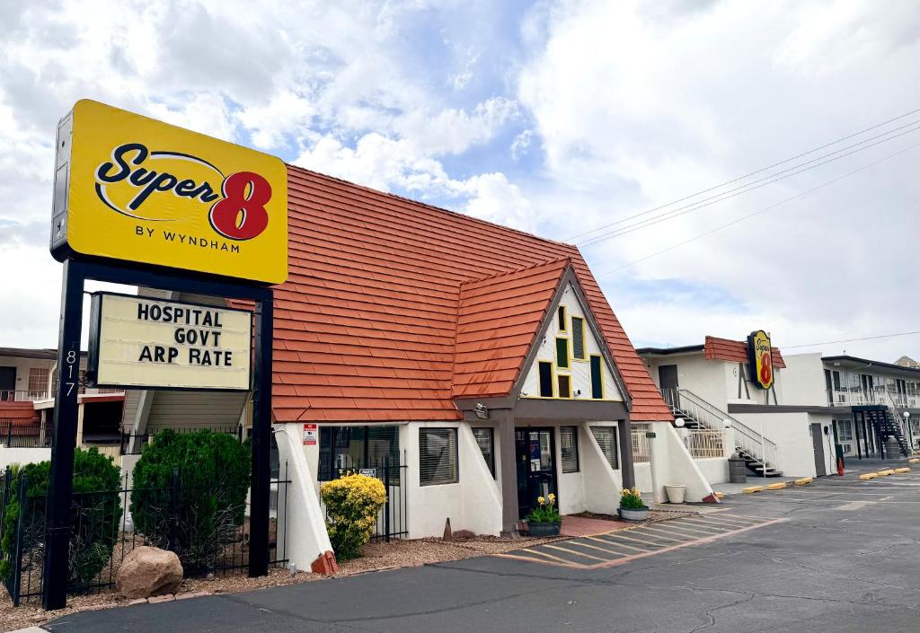 a super sign in front of a store at Super 8 by Wyndham Albuquerque Downtown in Albuquerque