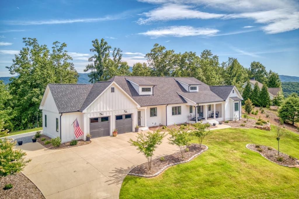 an image of a house with a driveway at Mountain Majesty in Mill Spring