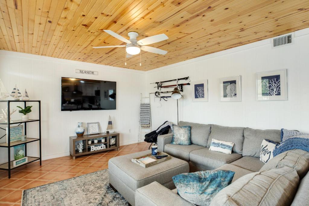 a living room with a couch and a ceiling fan at LT04FLR Torchbearer - Lower in Little Torch Key