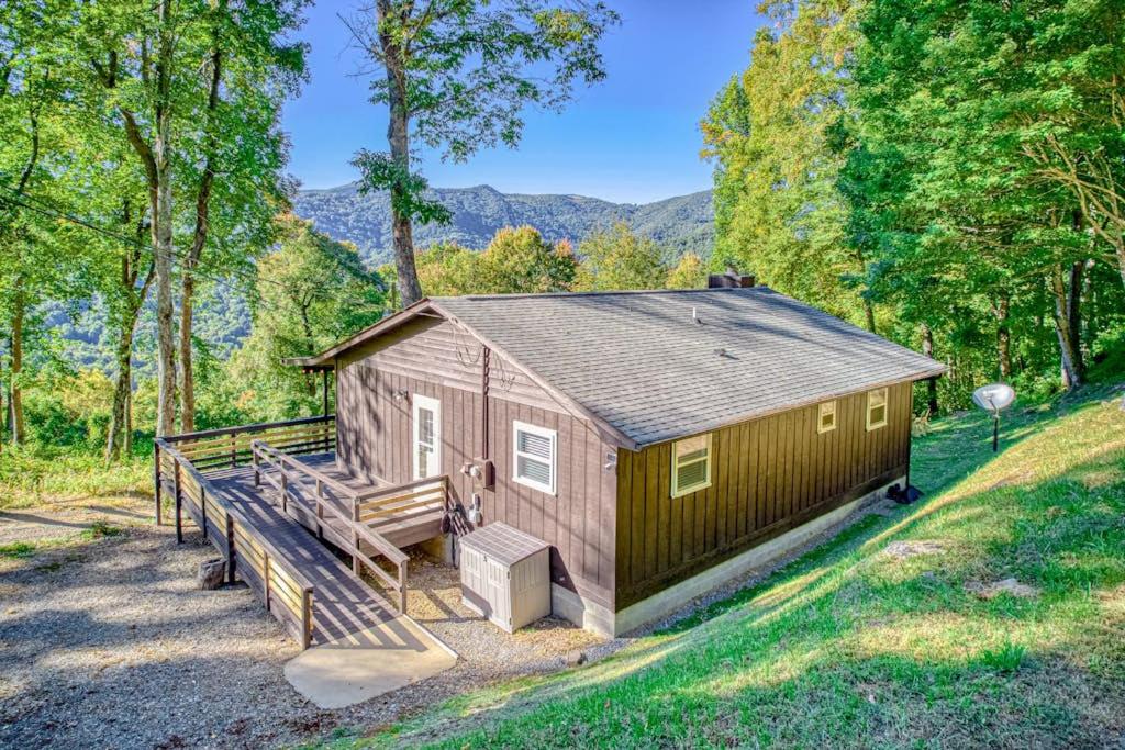 a tiny house in the middle of a field at Chipmunk Lane in Maggie Valley