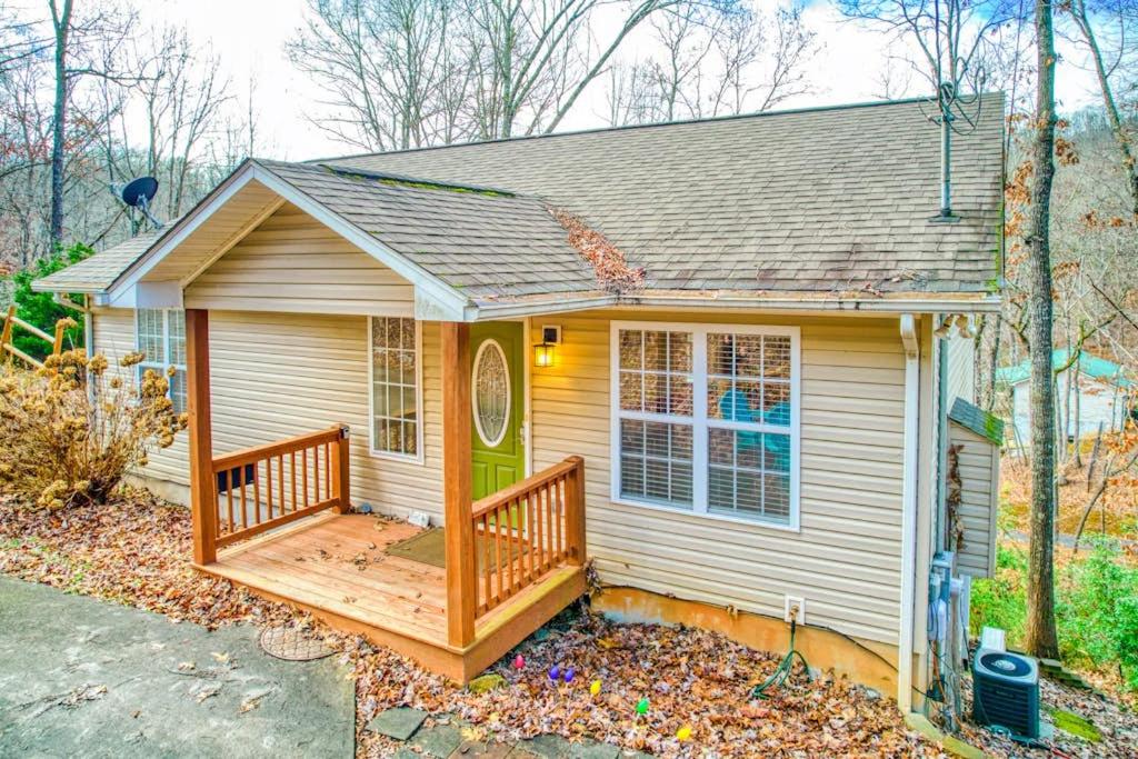 a small house with a porch and a deck at Trimont Mountain Cottage in Franklin