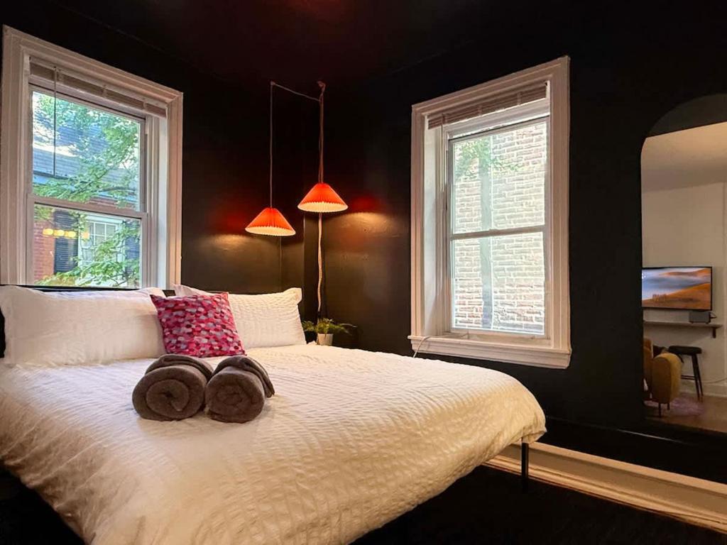 a bedroom with a bed with two donuts on it at Fifa Walkable King Bed Full Kitchen Central Apartment in Philadelphia