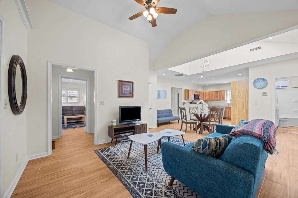 a living room with a blue couch and a table at Hominy Creek Haven in Candler