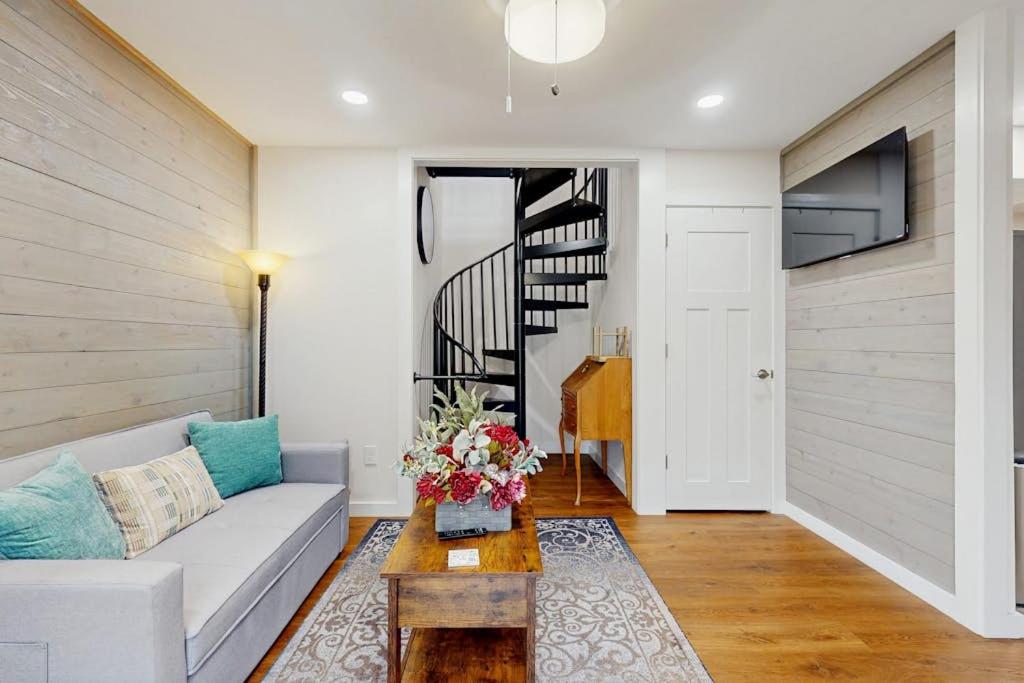 a living room with a couch and a table at Gibbs Getaway in Leicester