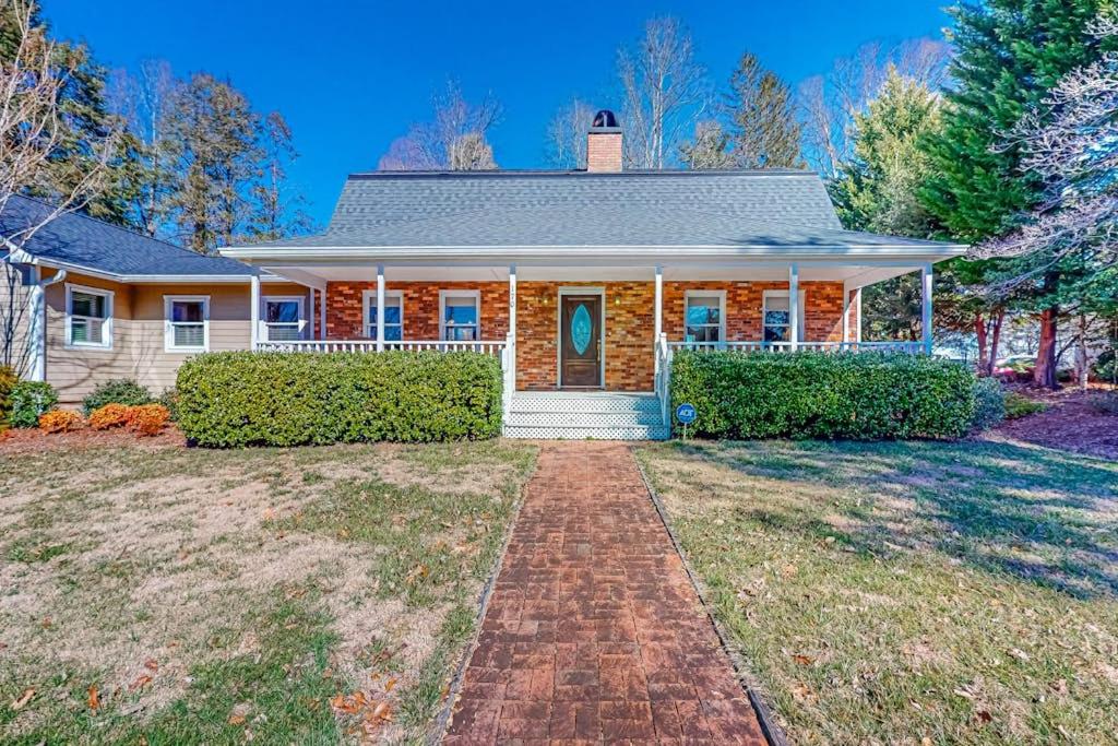 a house with a brick driveway in front of it at Brevard Bungalow in Brevard
