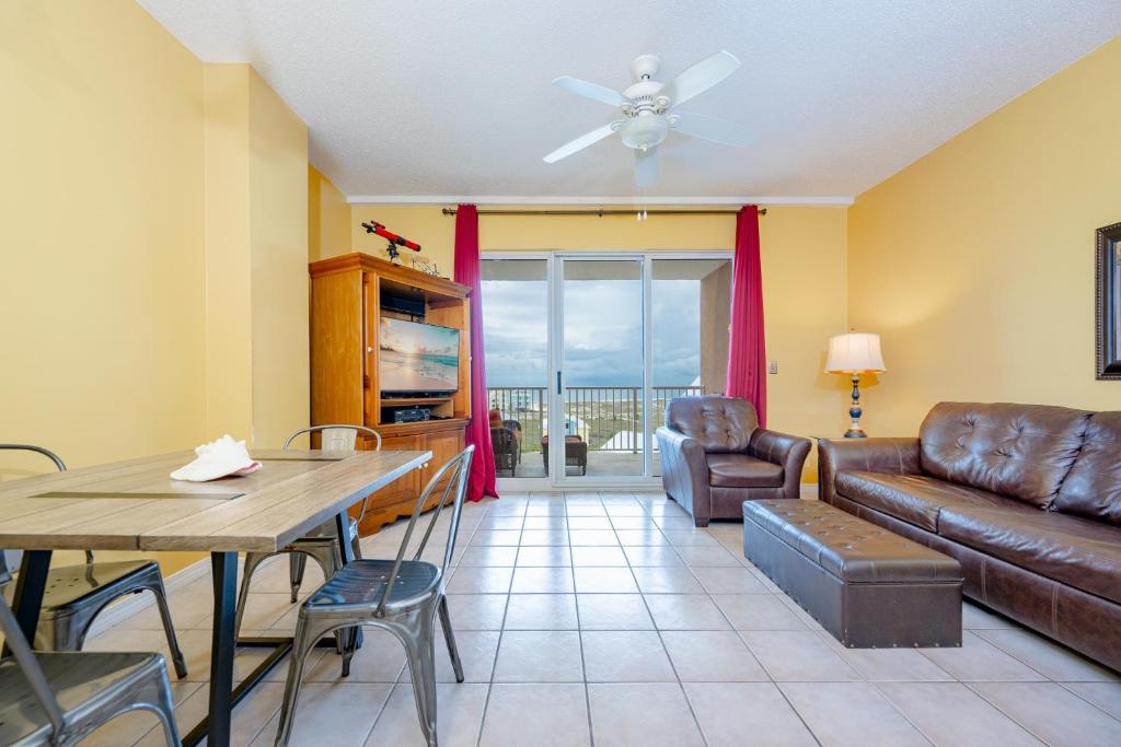 a living room with a couch and a table at The Dunes 503 in Gulf Shores