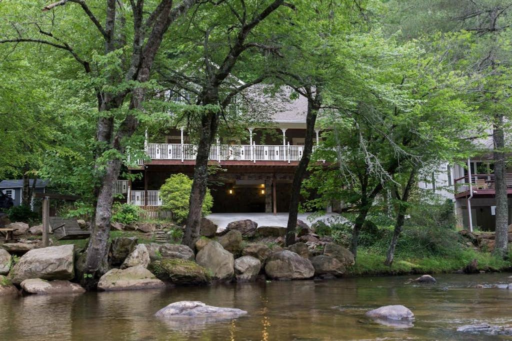 a house with a bridge over a river at Above the River in Sylva