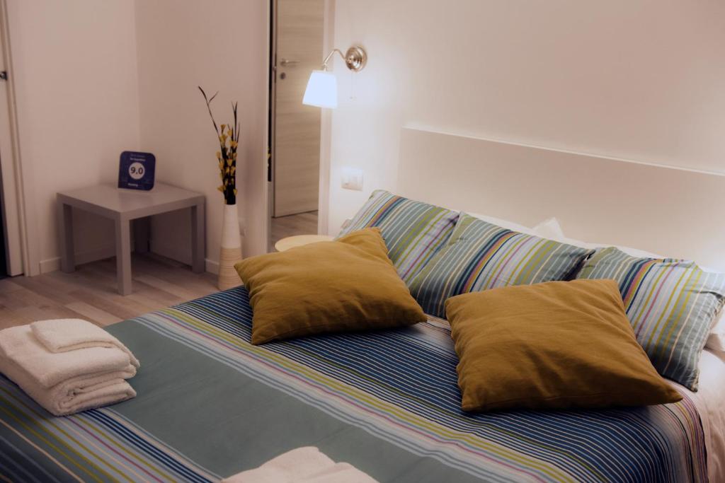 A bed or beds in a room at De Guestibus