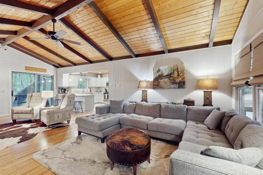 a living room with a couch and a table at Campfire Hideaway in Highlands