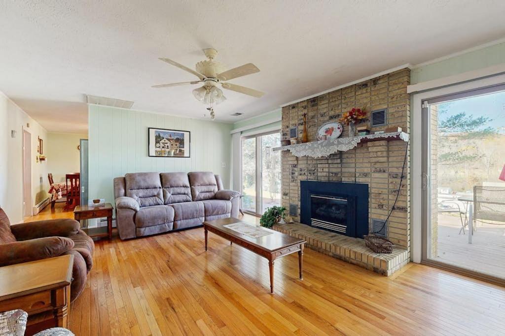 a living room with a couch and a fireplace at Shelba's Place in Sylva