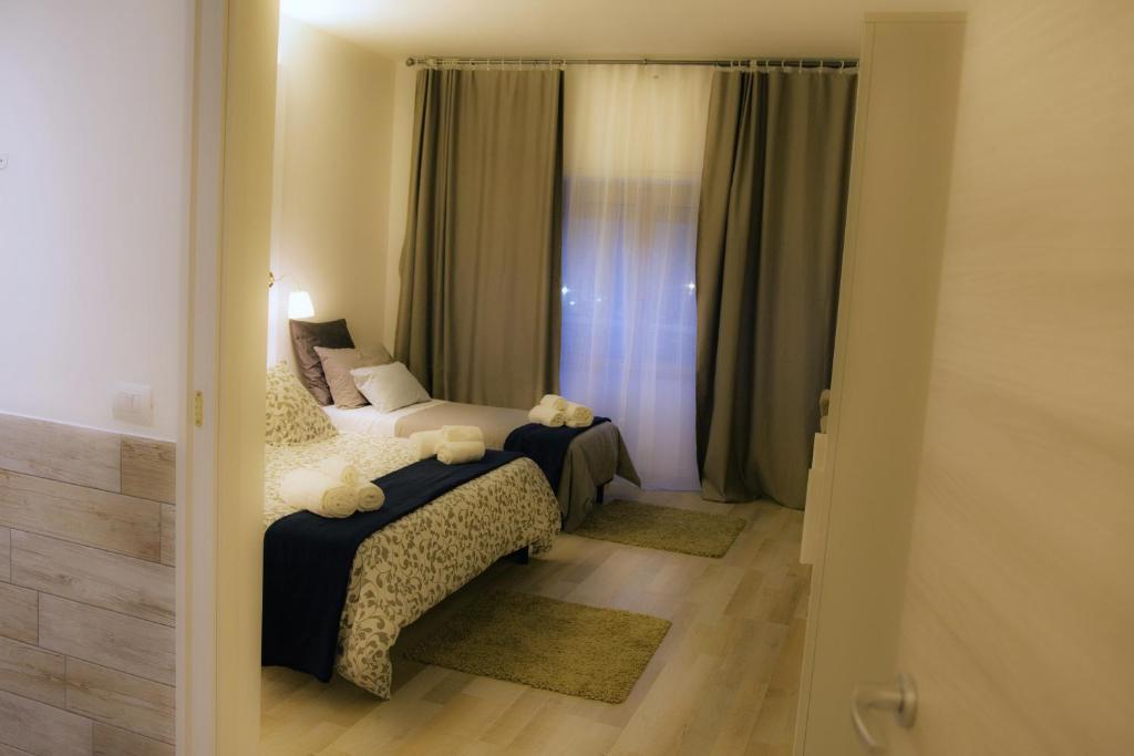 A bed or beds in a room at De Guestibus