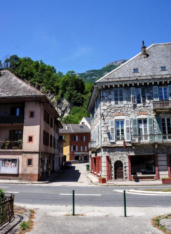 an old building on the side of a street at Les Suites du Quai in Montmélian