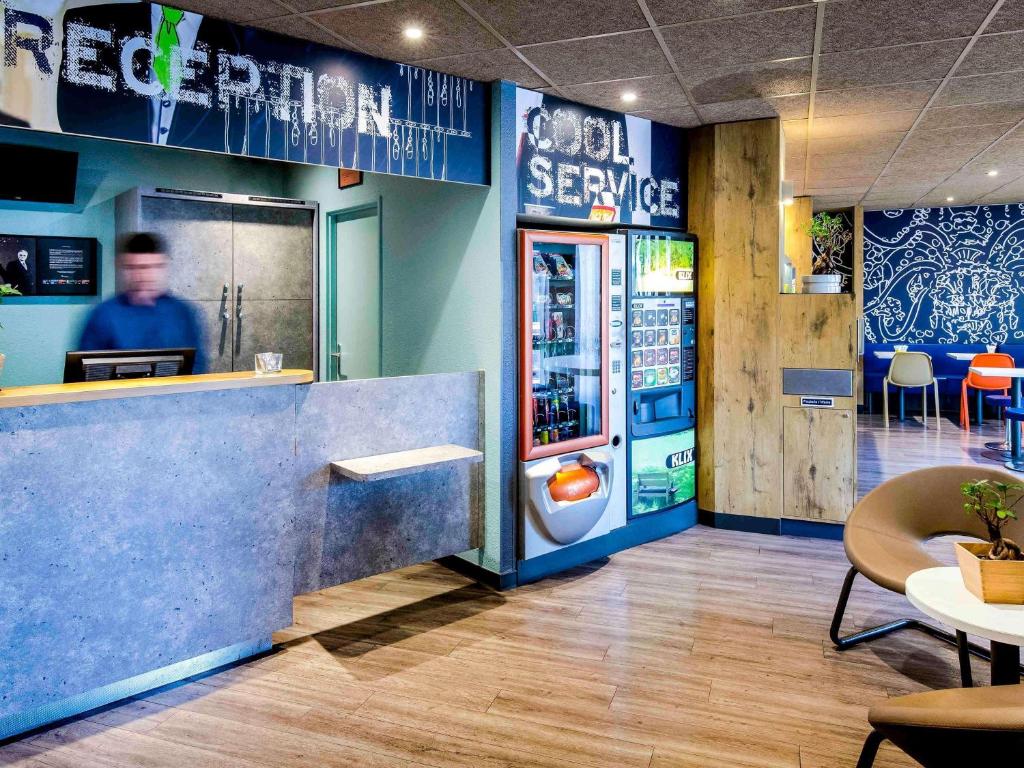 a fast food restaurant with a vending machine at Ibis Budget Marseille Timone in Marseille