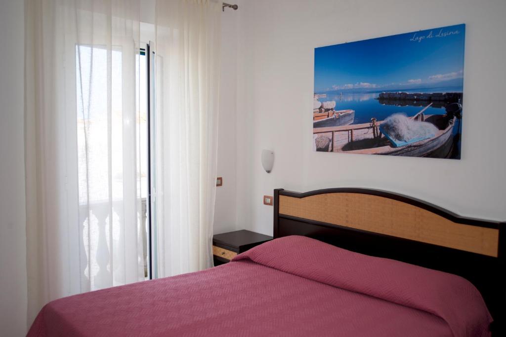 Postel nebo postele na pokoji v ubytování Le Antiche Porte