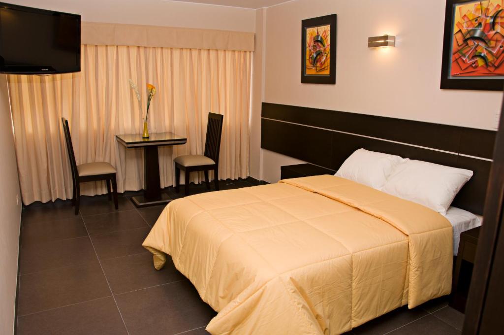 Voodi või voodid majutusasutuse Flamante Hotel & Suite toas