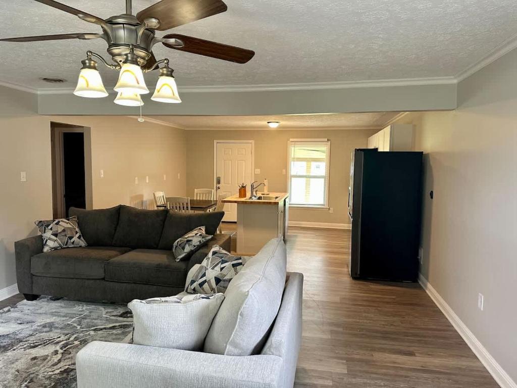a living room with a couch and a ceiling fan at Twin Oaks Haven in Murfreesboro
