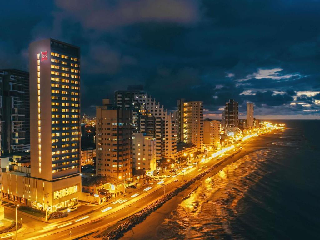 a city lit up at night with street lights at ibis Cartagena Marbella in Cartagena de Indias