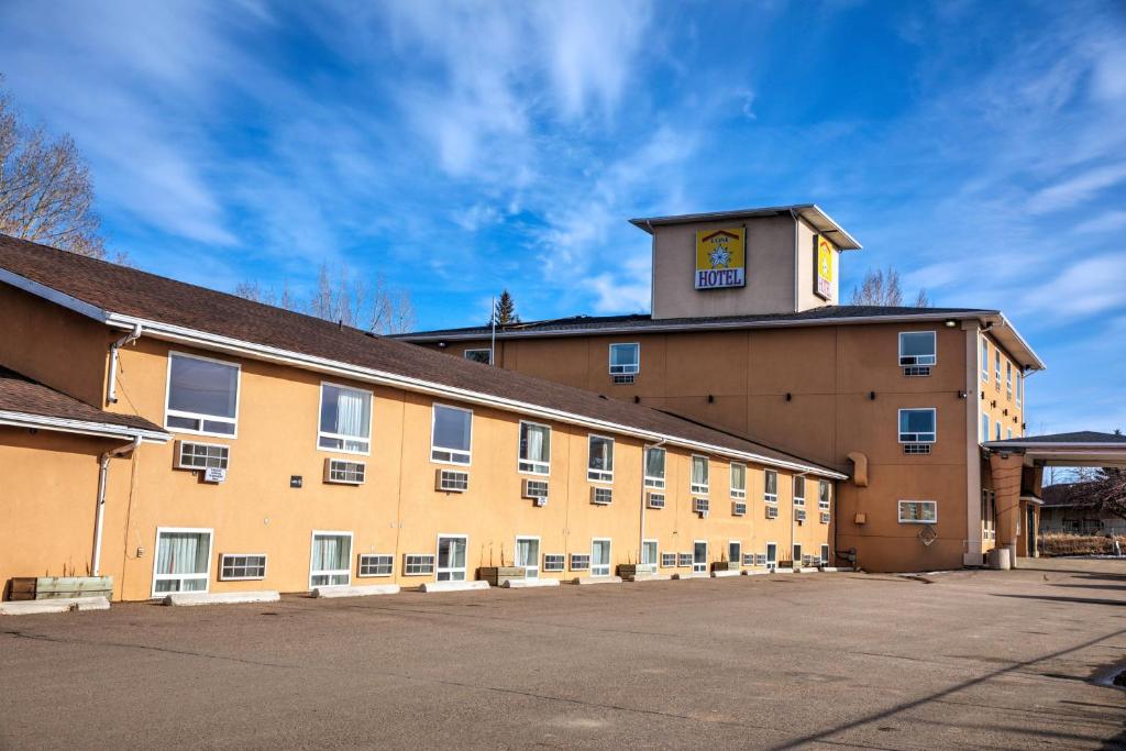 a large building with a clock tower on top of it at Lone Star Hotel in North Battleford