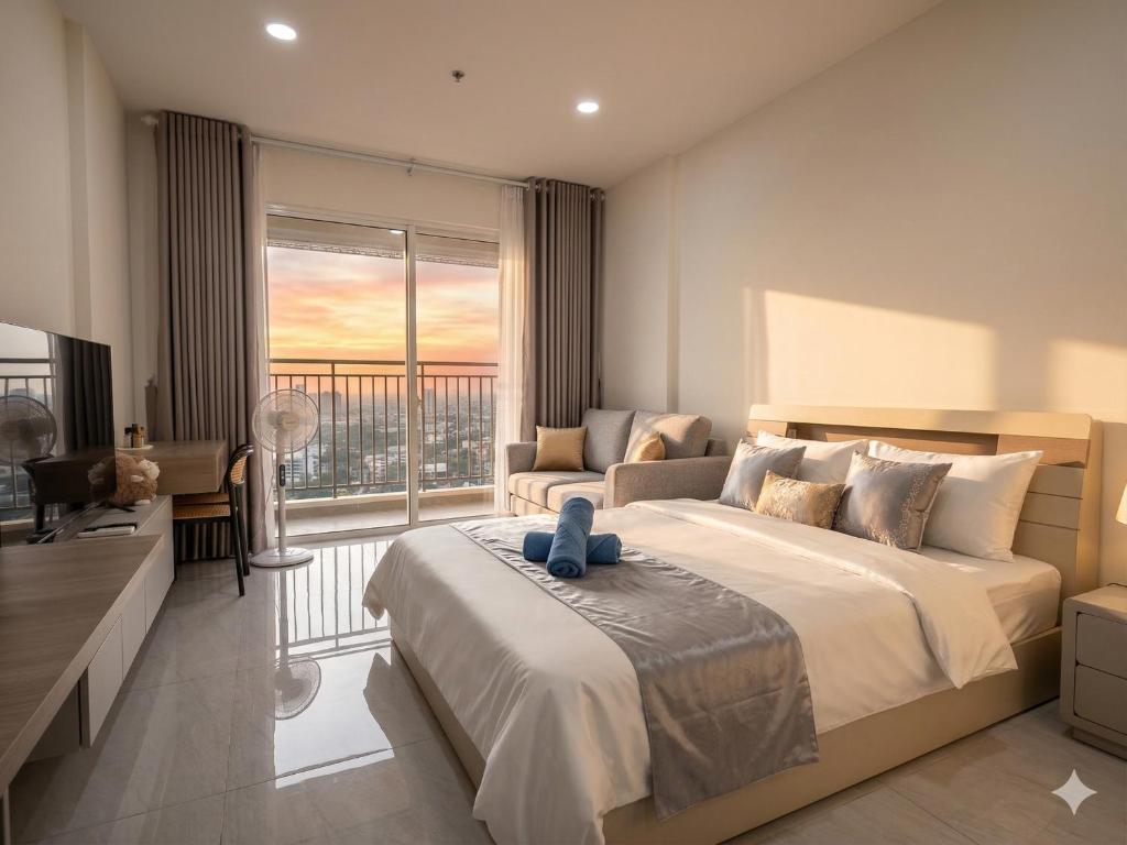 a bedroom with a large bed and a large window at Luxumiere Apartment with Resort Pool - Elite Gym in Ho Chi Minh City