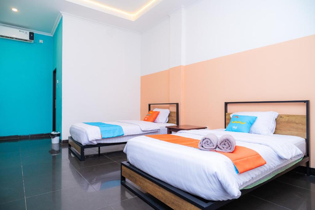 SANS Hotel Bobo Home Jambi - Deluxe-Zweibettzimmer