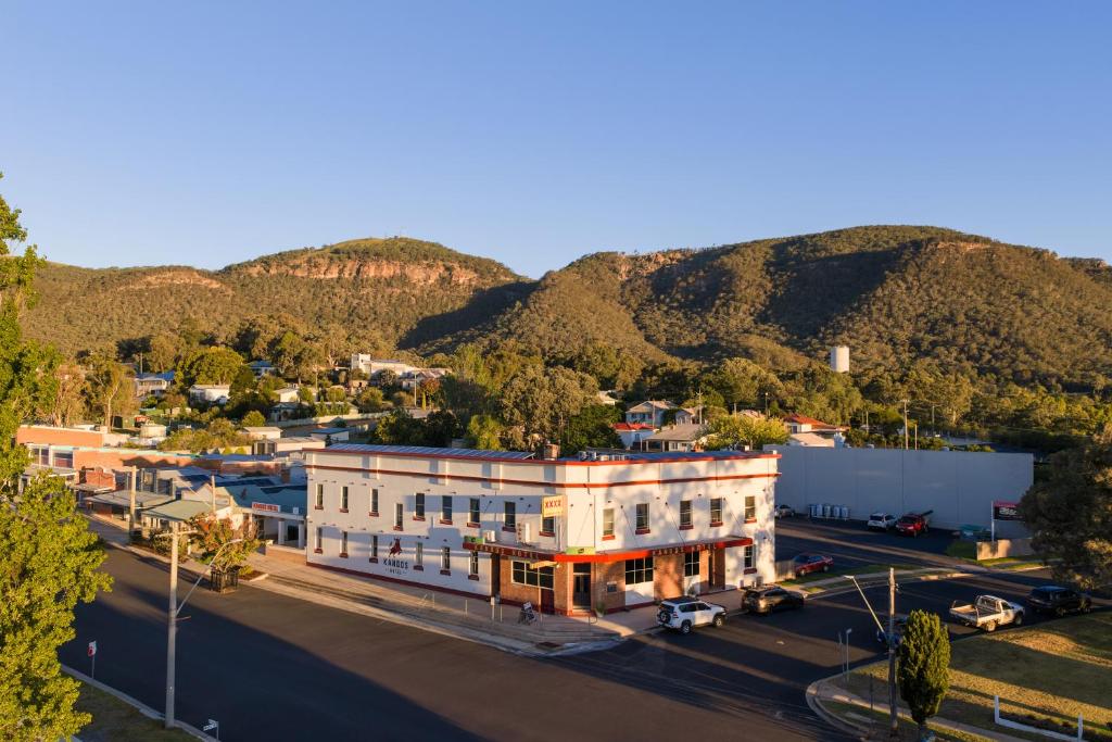 an aerial view of a building with mountains in the background at Kandos Hotel in Kandos